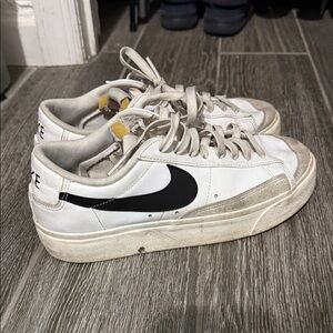 Nike White and Black Low-Top Sneakers with Red Logo Accent